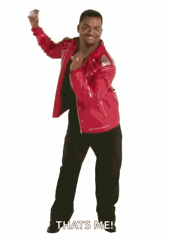 a man in a red jacket is dancing on a white background and saying `` that 's me '' .