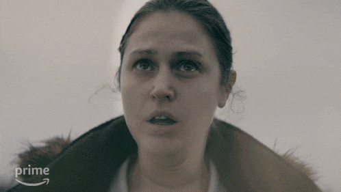 a close up of a woman 's face with an arrow pointing to the word prime