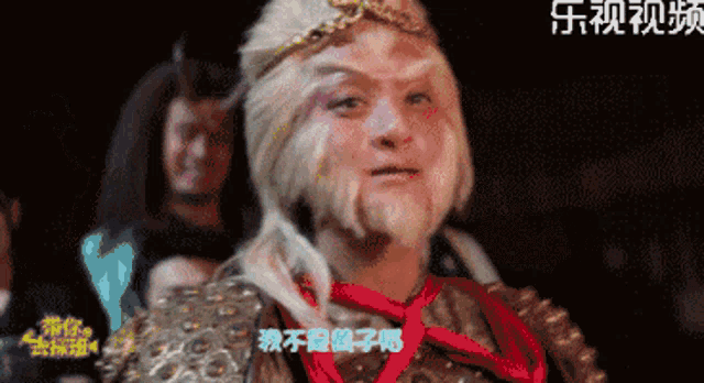 a man dressed as a monkey with chinese writing on the bottom
