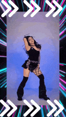 a woman in a black outfit is dancing in front of a neon background