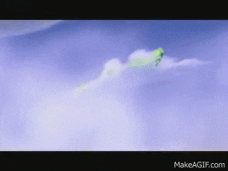 a green frog is flying through the clouds on make a gif.com