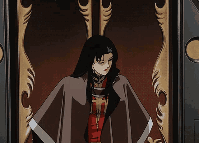 a woman with long black hair stands in front of a door