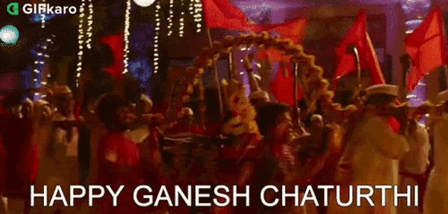 a group of people carrying a statue of ganesha on a carriage .