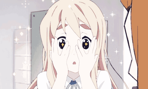 a girl covering her eyes with her hands and a surprised look on her face