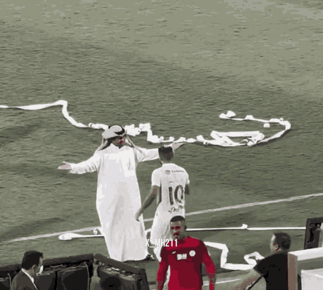 a man in a white robe with the number 10 on his jersey