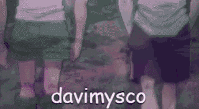 a close up of a person 's face with the words davimysco written in white letters on a purple background .