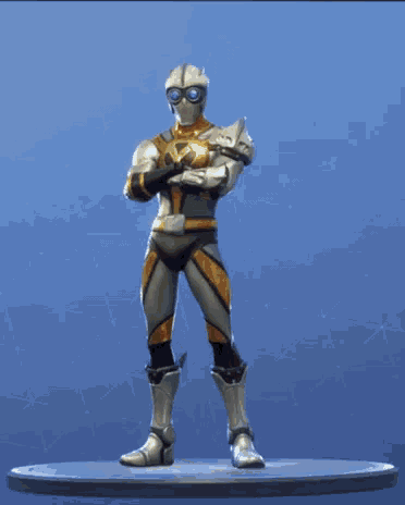 a figurine of a knight with his arms outstretched is standing on a pedestal .