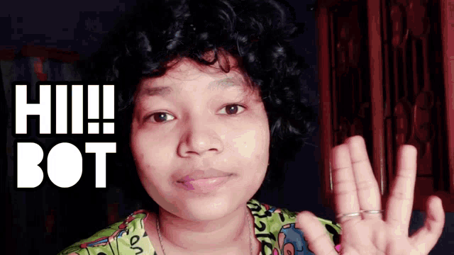 a woman in a green shirt says hi bot