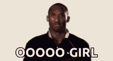 a man in a black shirt is standing in front of a microphone and saying oooo girl .