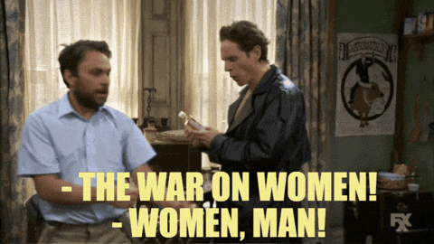 two men in a room with the words " the war on women " on the screen