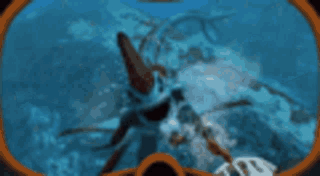 a shark is swimming in the water with its mouth wide open
