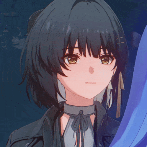a close up of a girl 's face with dark hair