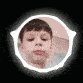 a close up of a child 's face in a white circle .