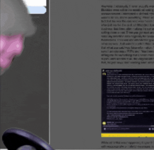 a woman wearing a headset is looking at a screen