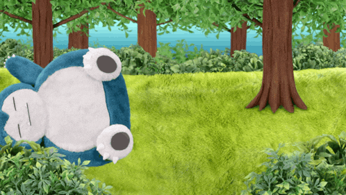 a stuffed animal is laying on its back in a grassy field