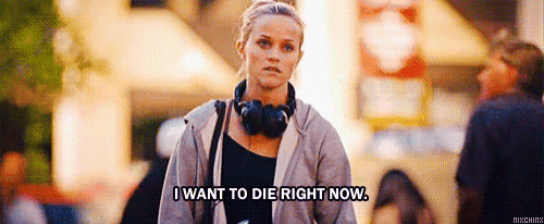a woman wearing headphones is walking down the street and saying `` i want to die right now . ''