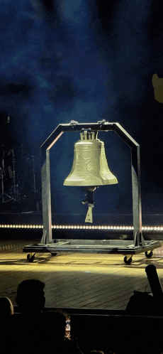 a large bell with a crown on top of it