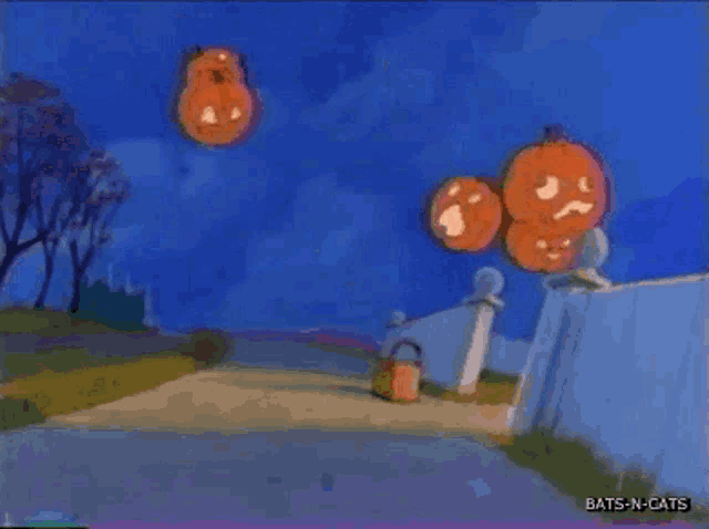 a bunch of pumpkins are floating in the air with bats-n-cats written in the corner