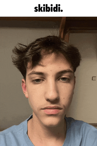a picture of a young man with the words skibidi on the top
