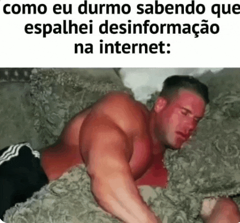 a muscular man is laying on a couch with a blanket on his back .