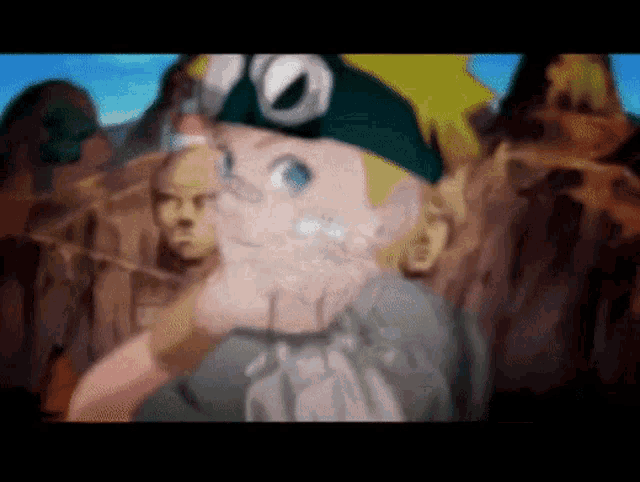 a blurry picture of a cartoon character with a green hat