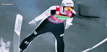 a ski jumper is wearing a gornje helmet and goggles
