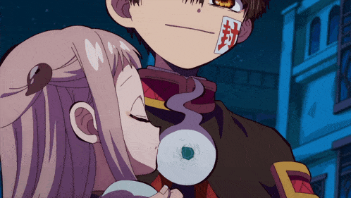a boy and a girl are standing next to each other and the boy has a sticker on his face that says " 封 "