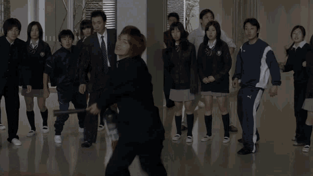 a group of people are standing in a hallway with smoke coming out of a can that says puma