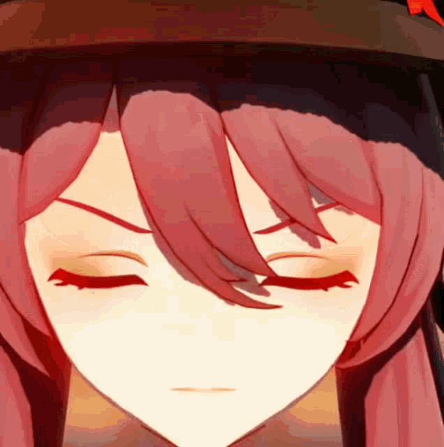 a close up of a girl 's face with her eyes closed and a hat .