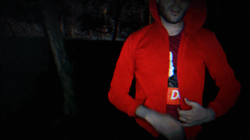 a man wearing a red jacket with the letter d on the front