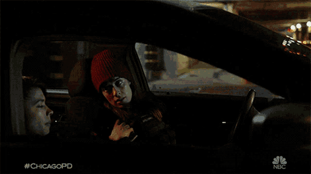 two women in a car with #chicagopd written on the screen