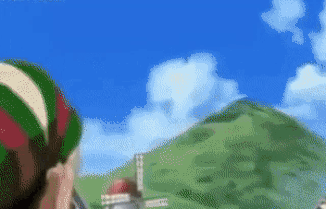 a pixel art of a person holding a green and red ball