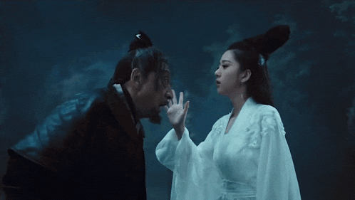 a man and a woman standing next to each other