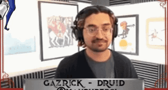 gazrick druid is wearing headphones and standing in front of a sign