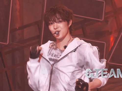 a woman in a white jacket with the word fear on the bottom right