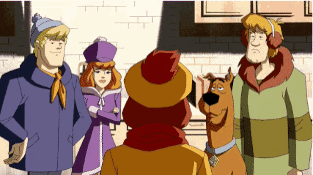 a group of scooby doo characters are standing together