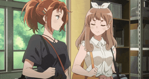 two anime girls are standing next to each other in a library