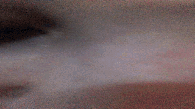 a close up of a person 's nose with a blurred background