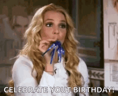 a woman is blowing a party horn and saying `` celebrate you 're birthday ! ''