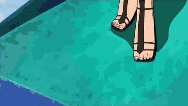 a woman wearing sandals is standing on a blue carpet .
