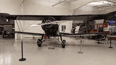 a plane in a museum has ww on the side