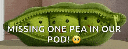 a stuffed peas pod with three peas inside of it and the words `` missing one pea in our pod ! ''