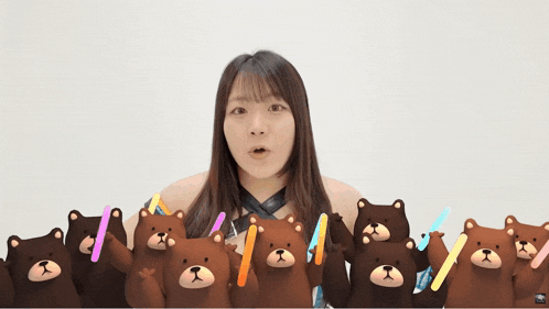 a woman is surrounded by a bunch of brown bears holding glow sticks