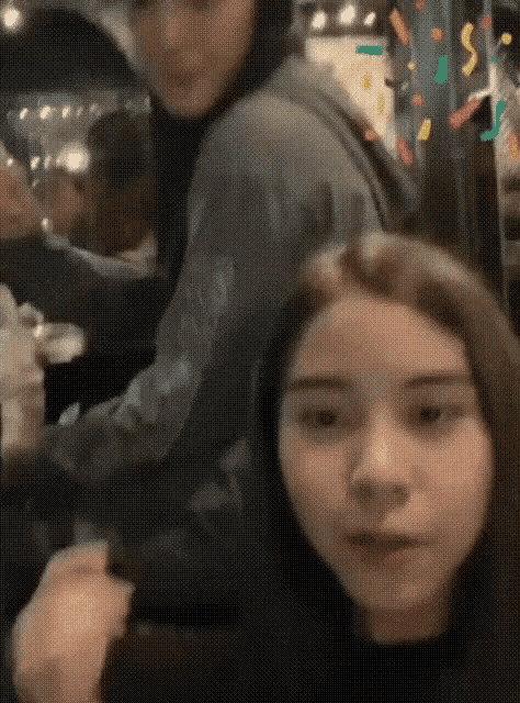 a man and a woman are standing next to each other