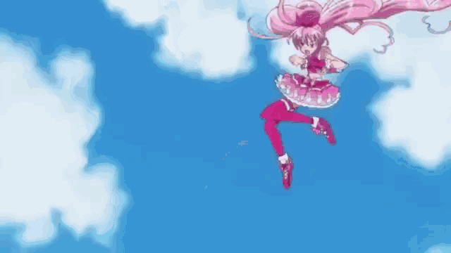 a girl in a pink dress is flying through the sky .