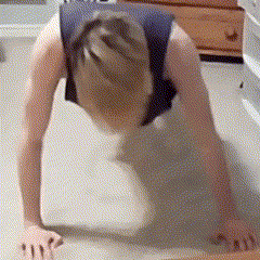 a person doing push ups on the floor with their hands on the floor