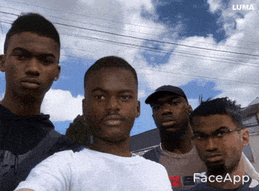 a group of young men are posing for a picture with a luma logo on the bottom