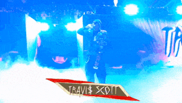 a sign that says travis scott on it in red
