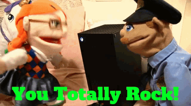 a picture of two puppets with the words you totally rock in green