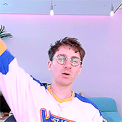 a man wearing glasses and a jersey that says u.s.a. on it